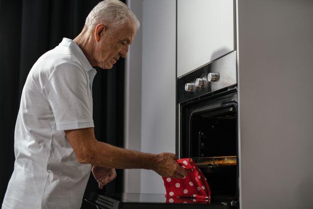 Man baking in oven